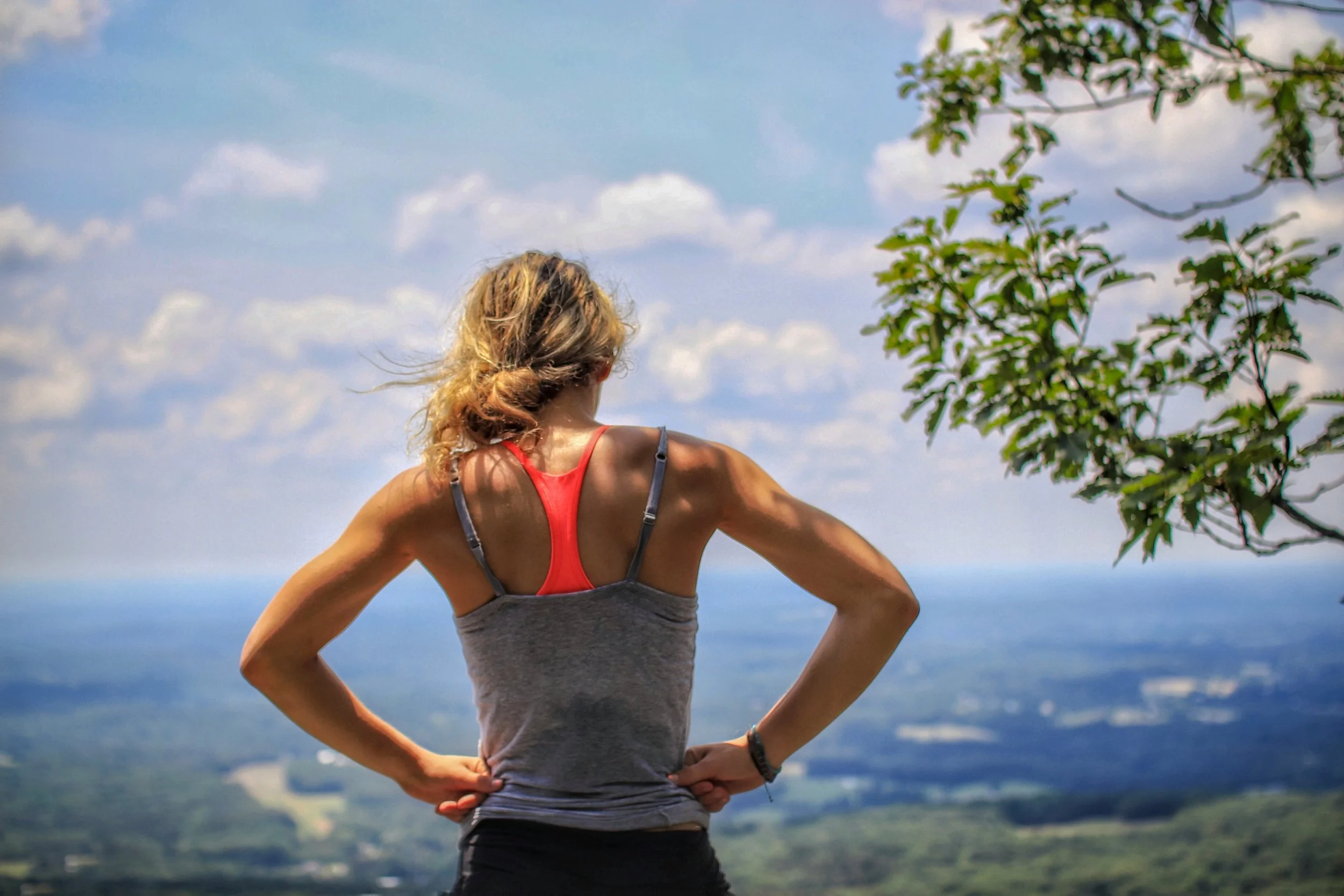 The back of a woman exercising with view