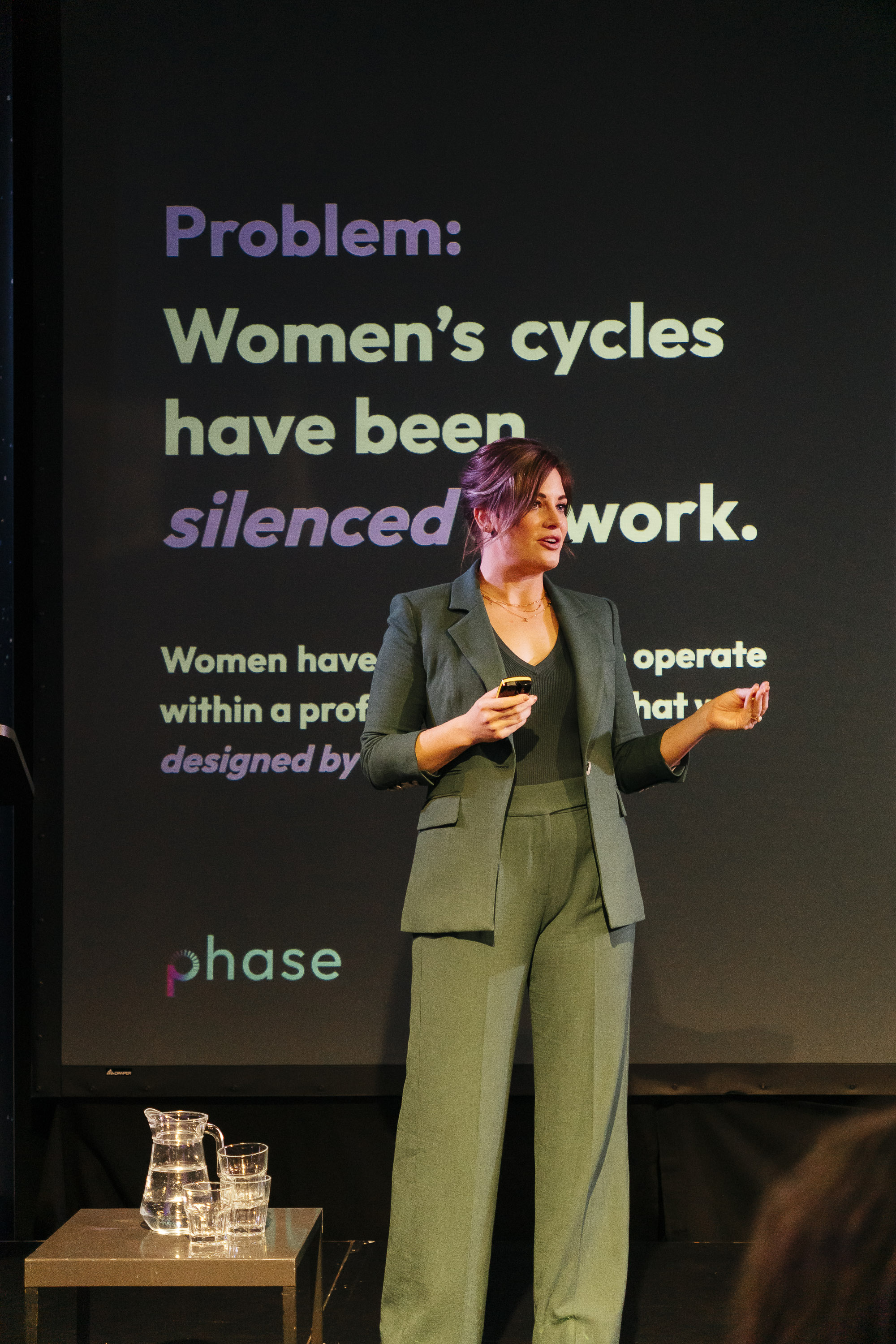 Maggie McDaris Speaking on Stage about Phase at Decoded Event 