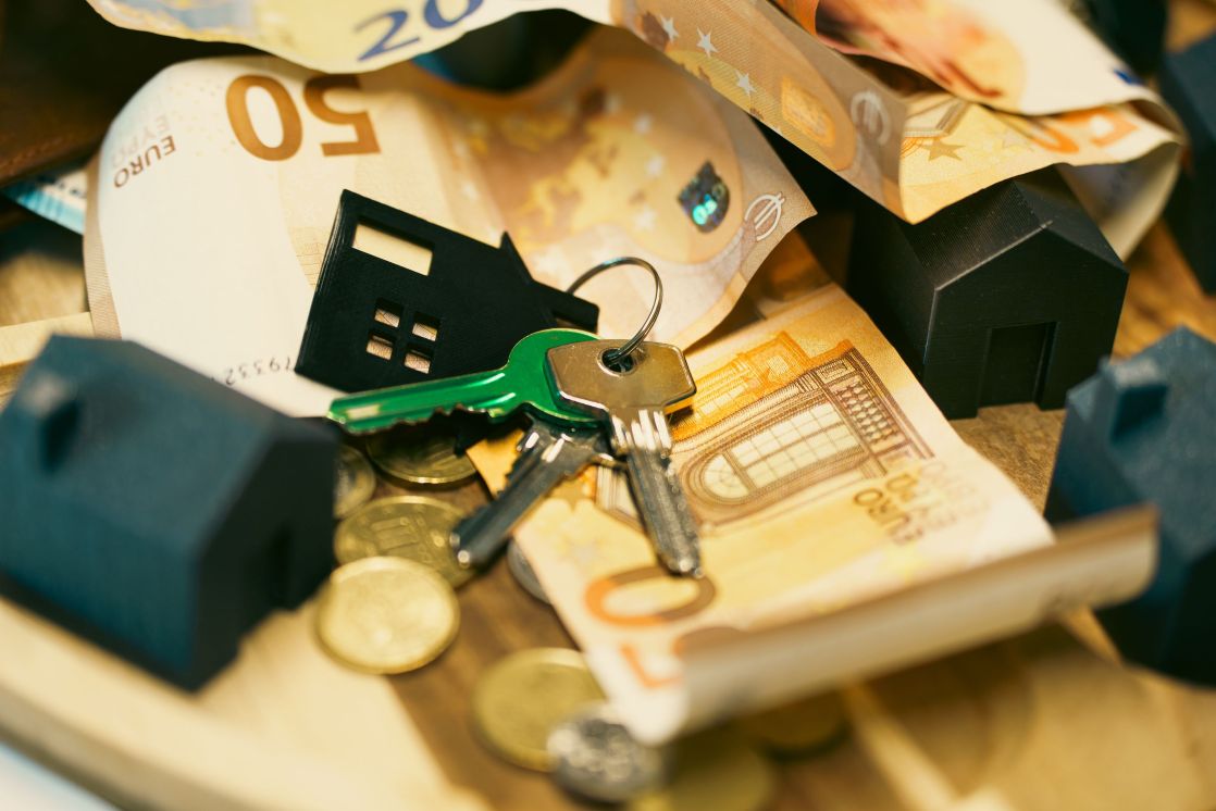 image of housekey on top of money