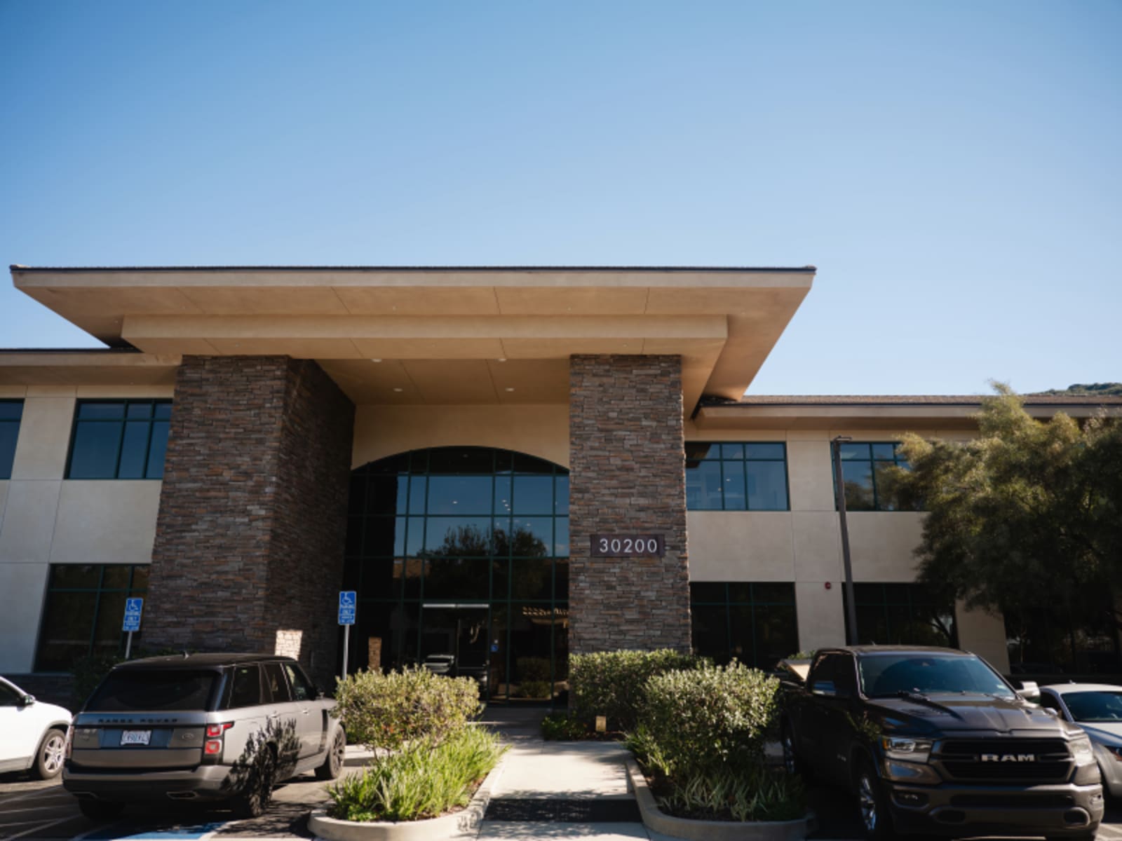 Modern dental practice exterior with contemporary architecture and large glass windows