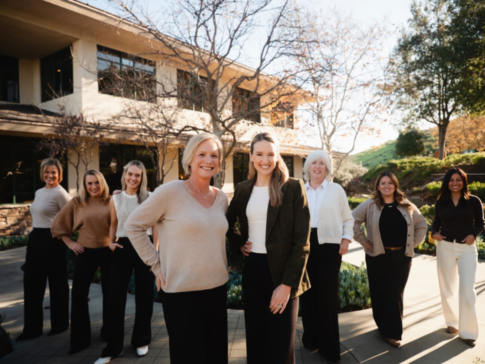 Restore Dental Studio team standing together outside the practice building