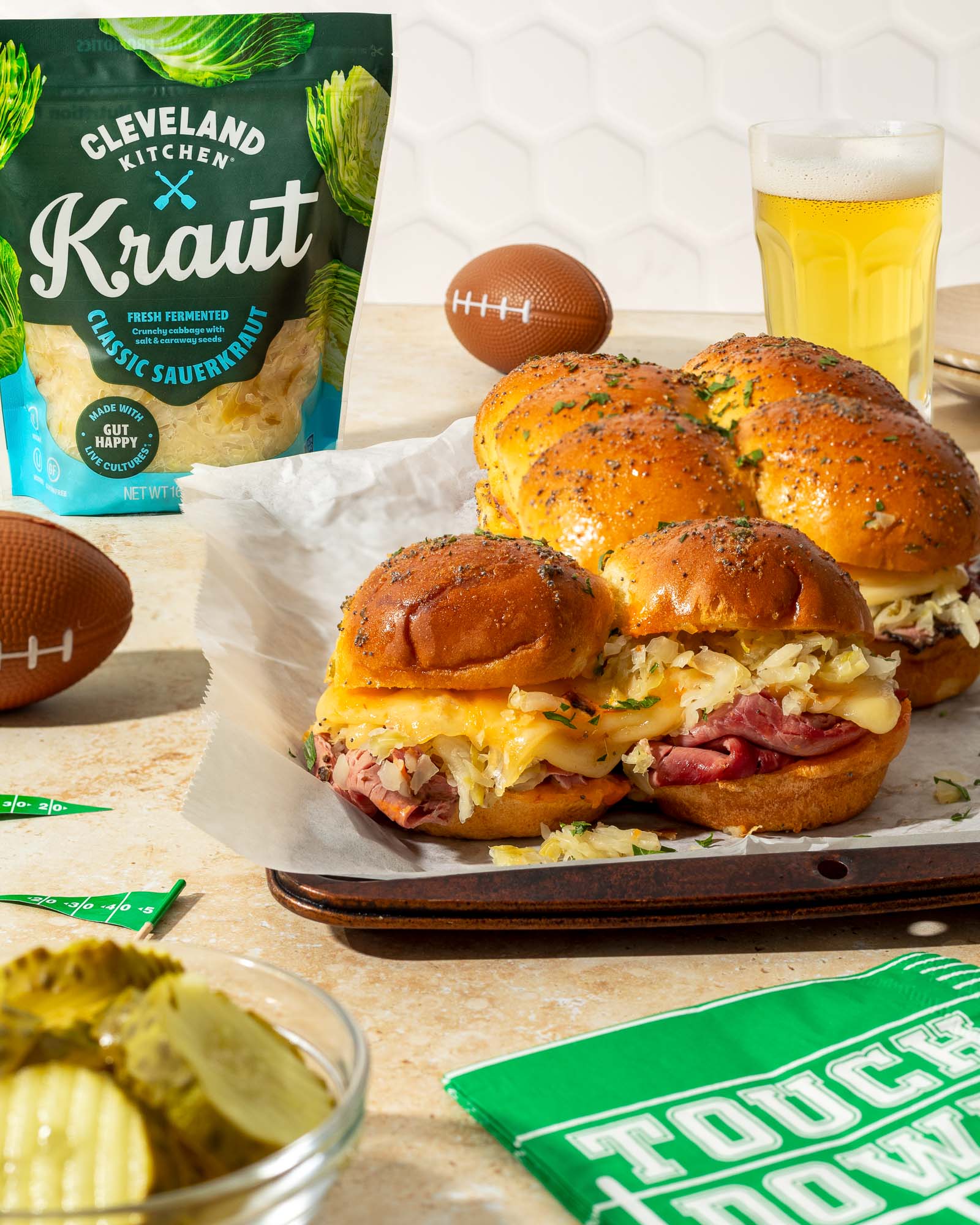Reuben sliders for game day topped with Cleveland Kitchen sauerkraut