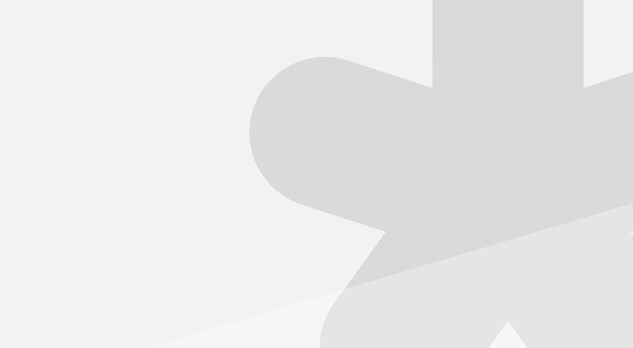 Close-up of a smooth, light-colored surface with soft shadows.