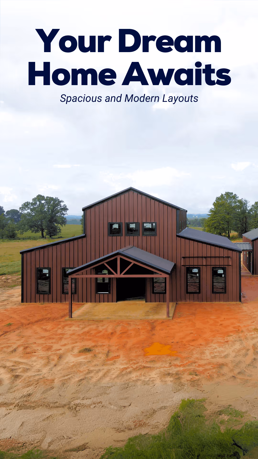 Modern barn-style home with brown vertical siding and a covered entrance, surrounded by a dirt and grassy landscape.