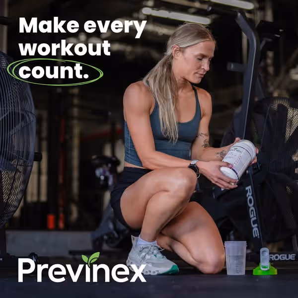 Athletic woman in gym attire kneeling on floor, preparing a supplement drink next to workout equipment, with text 'Make every workout count.' and Previnex logo.