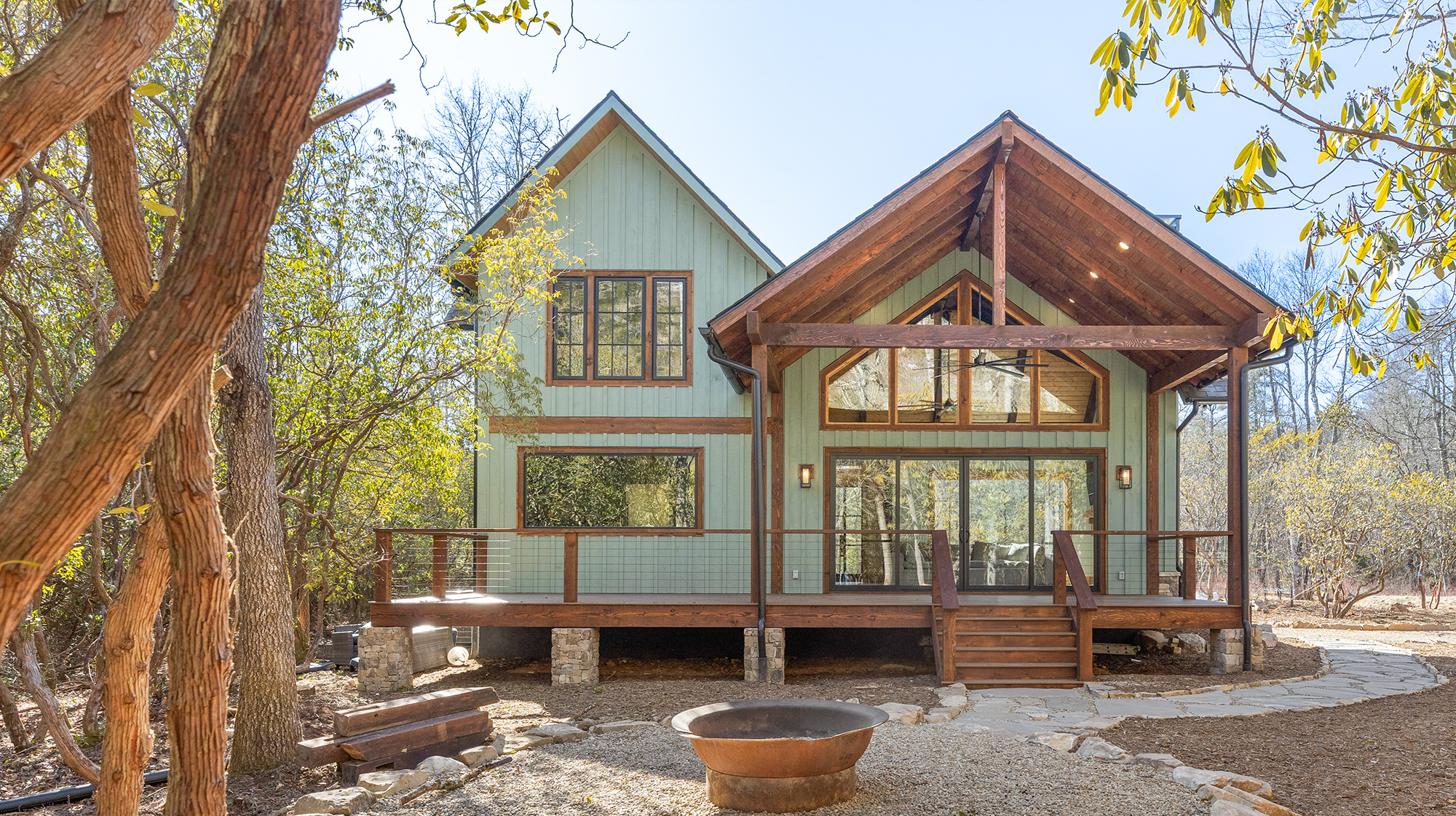 A backyard view of a beautiful mountain home with a  fireplace from the Civil War era.