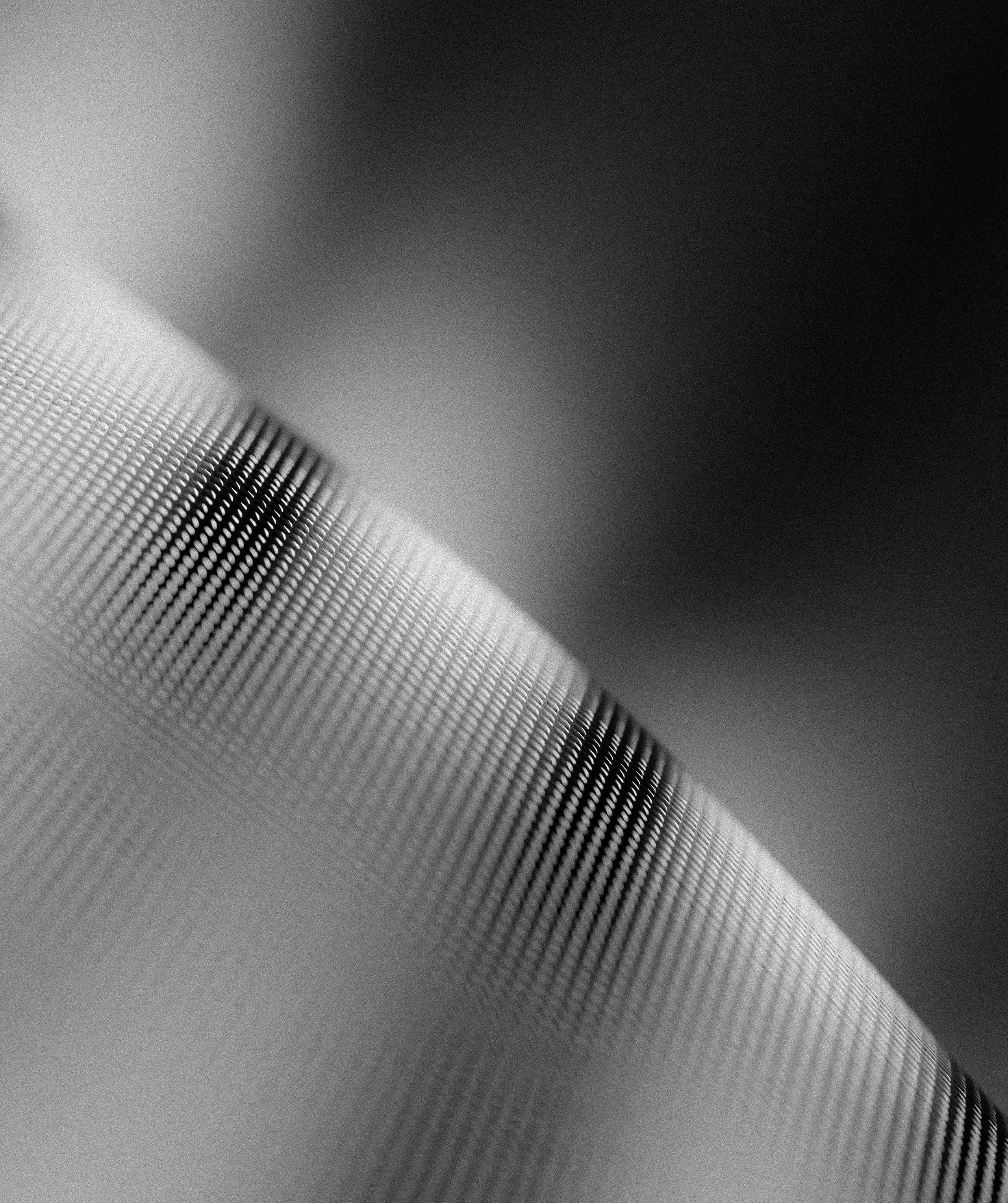 Close-up of a textured surface with a wavy pattern in black and white.