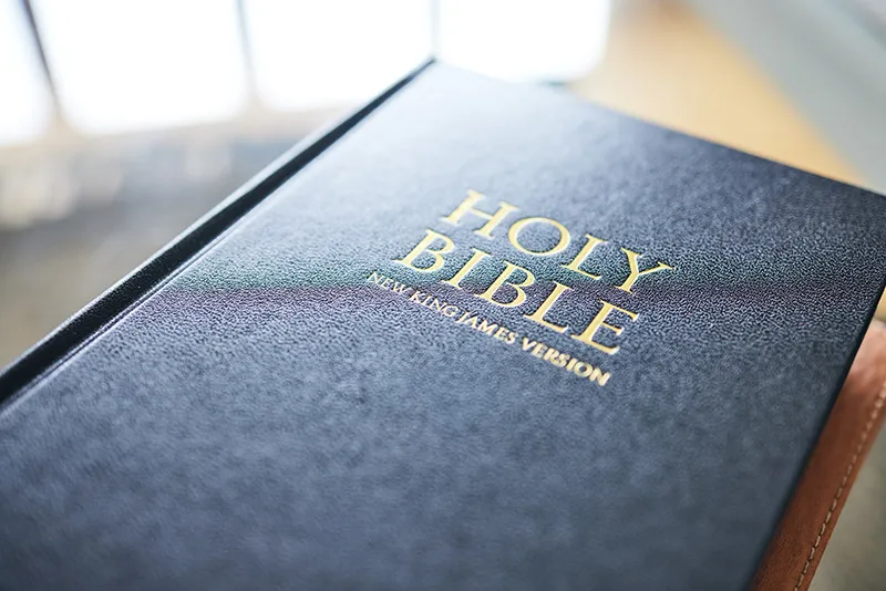 The Holy Bible sitting on a desk at Dynamic Faith Ministries 