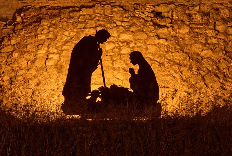 Jesus Christ's tomb that her crawled of of with a cross at the opening of the cave