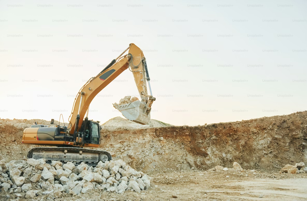 Excavator working on a large earthworks site