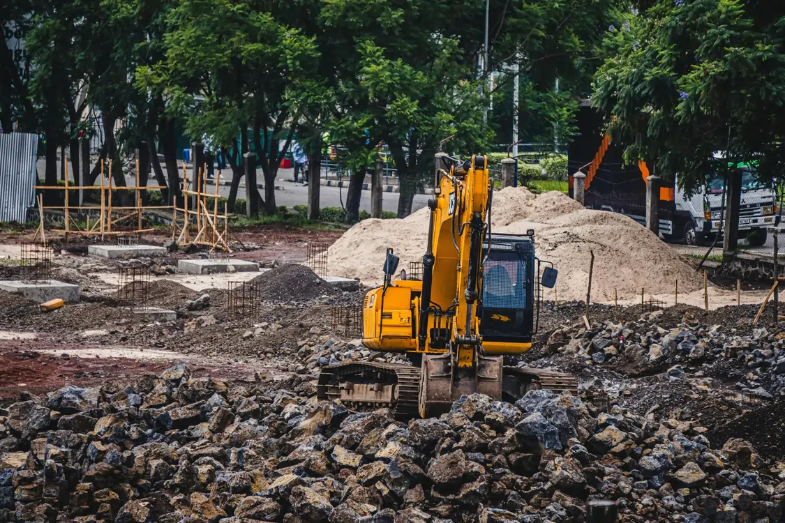 Excavator working on a large earthworks site
