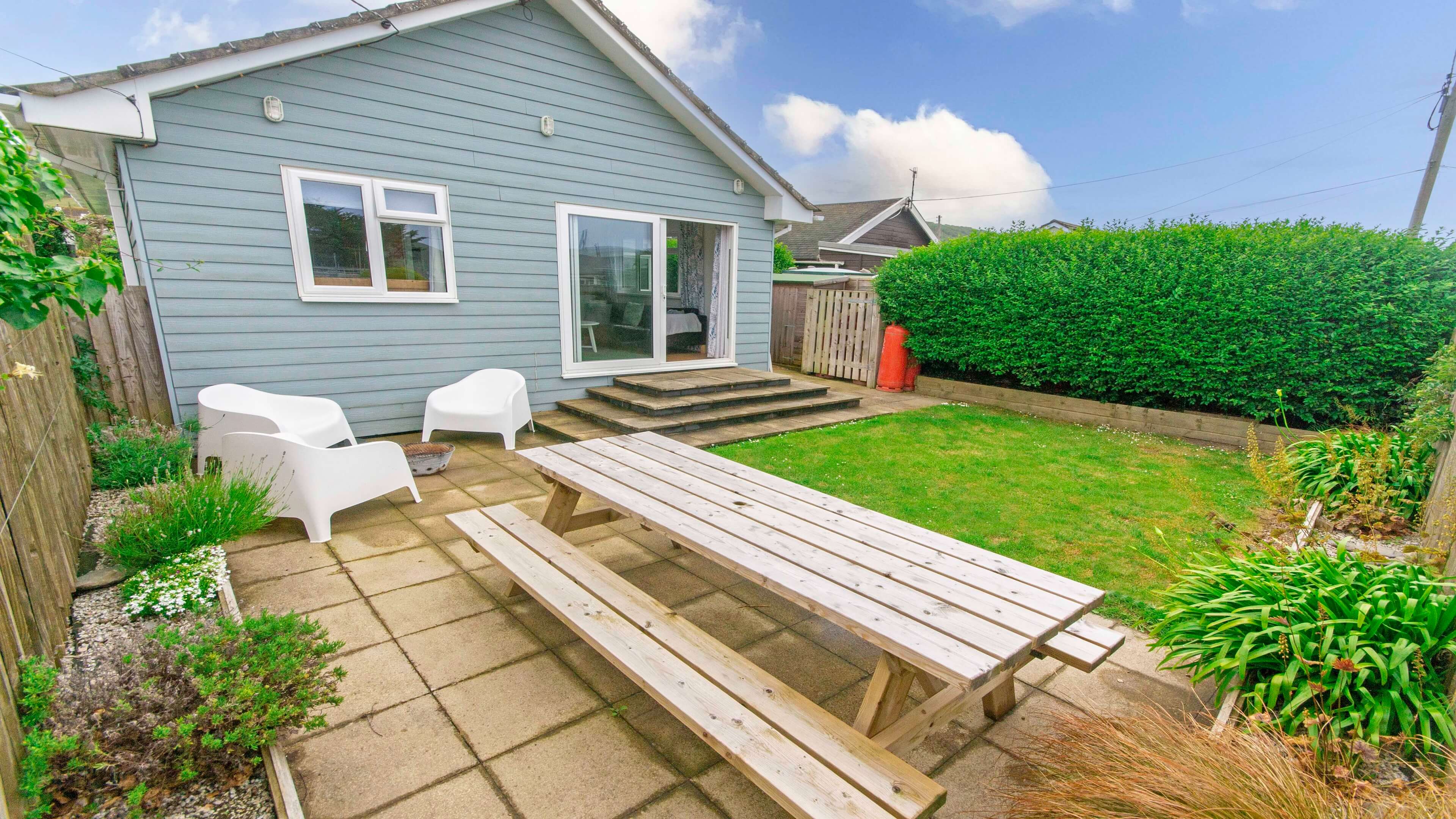 Rear Garden with patio furniture