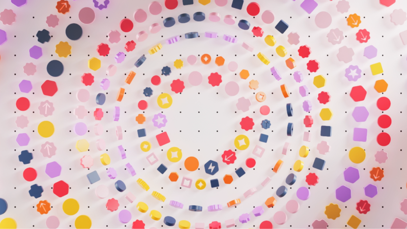 Colorful geometric shapes including circles, hexagons, and squares arranged in spiraling patterns on a light background.