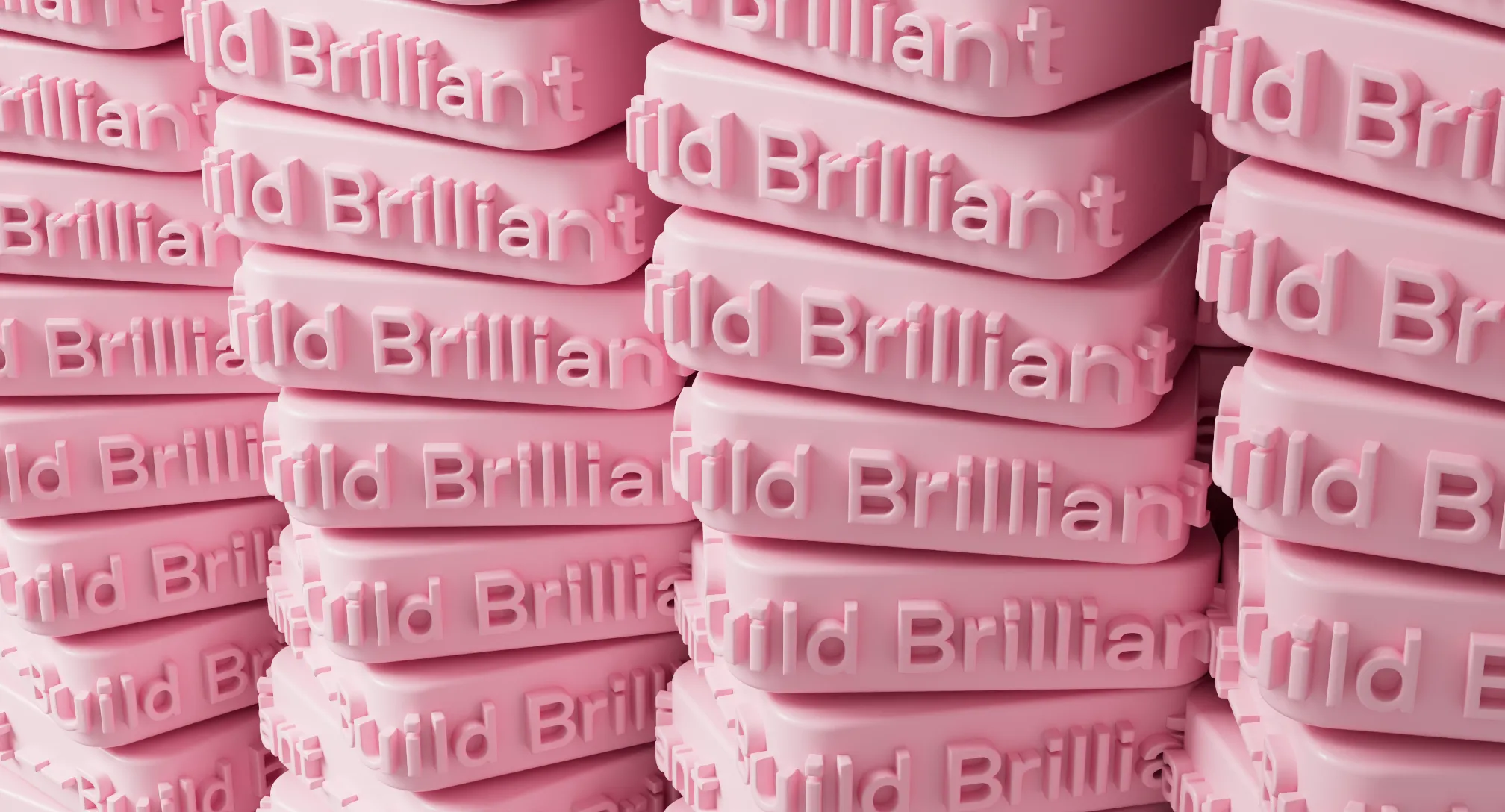 Stacks of pink rectangular blocks embossed with the words 'Build Brilliant'.