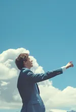 Three masked cleaning staff mopping the floor in a living room with a gray sofa and plant.