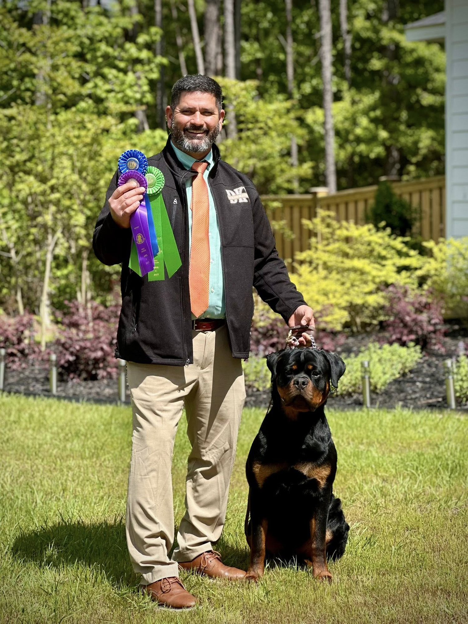 German Rottweiler bred by DKV winning AKC show ribbons with breeder Angel Gutierrez