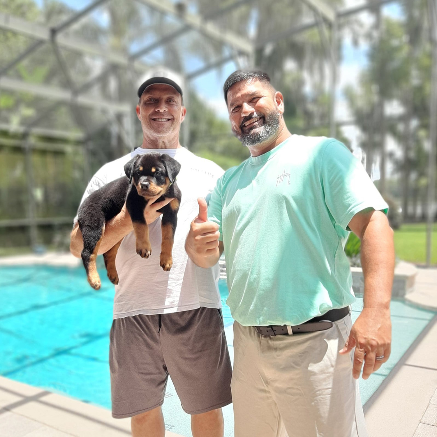 Angel Gutierrez personally delivering a DKV Rottweiler puppy to a new family during structured nationwide placement.
