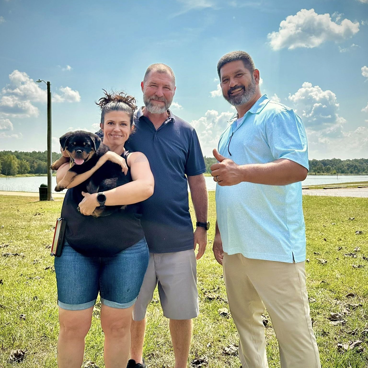 DKV Rottweilers breeder overseeing direct puppy placement to approved waiting list family.