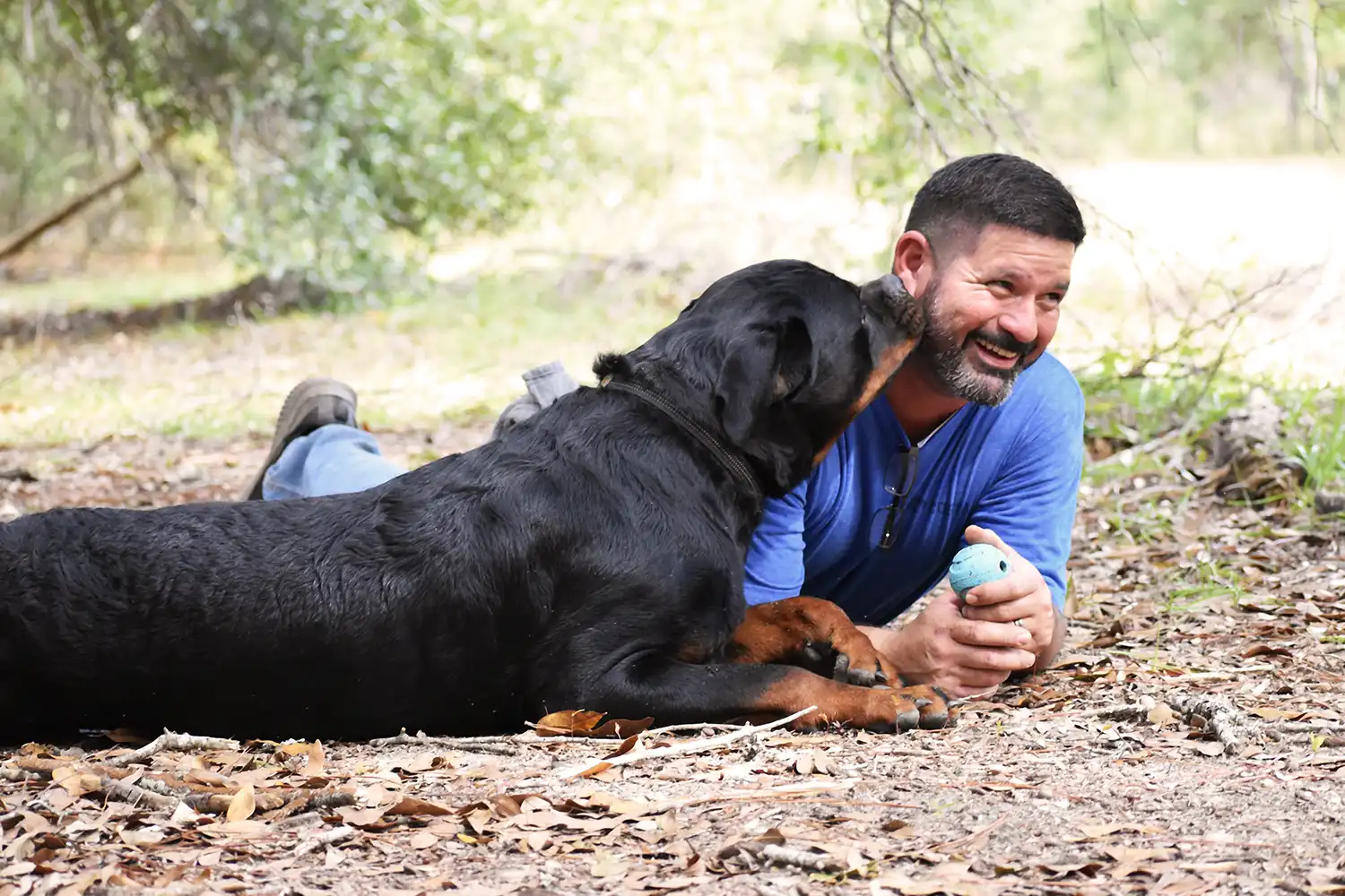 Angel Gutierrez with adult female and offspring German Rottweilers from DKV breeding program