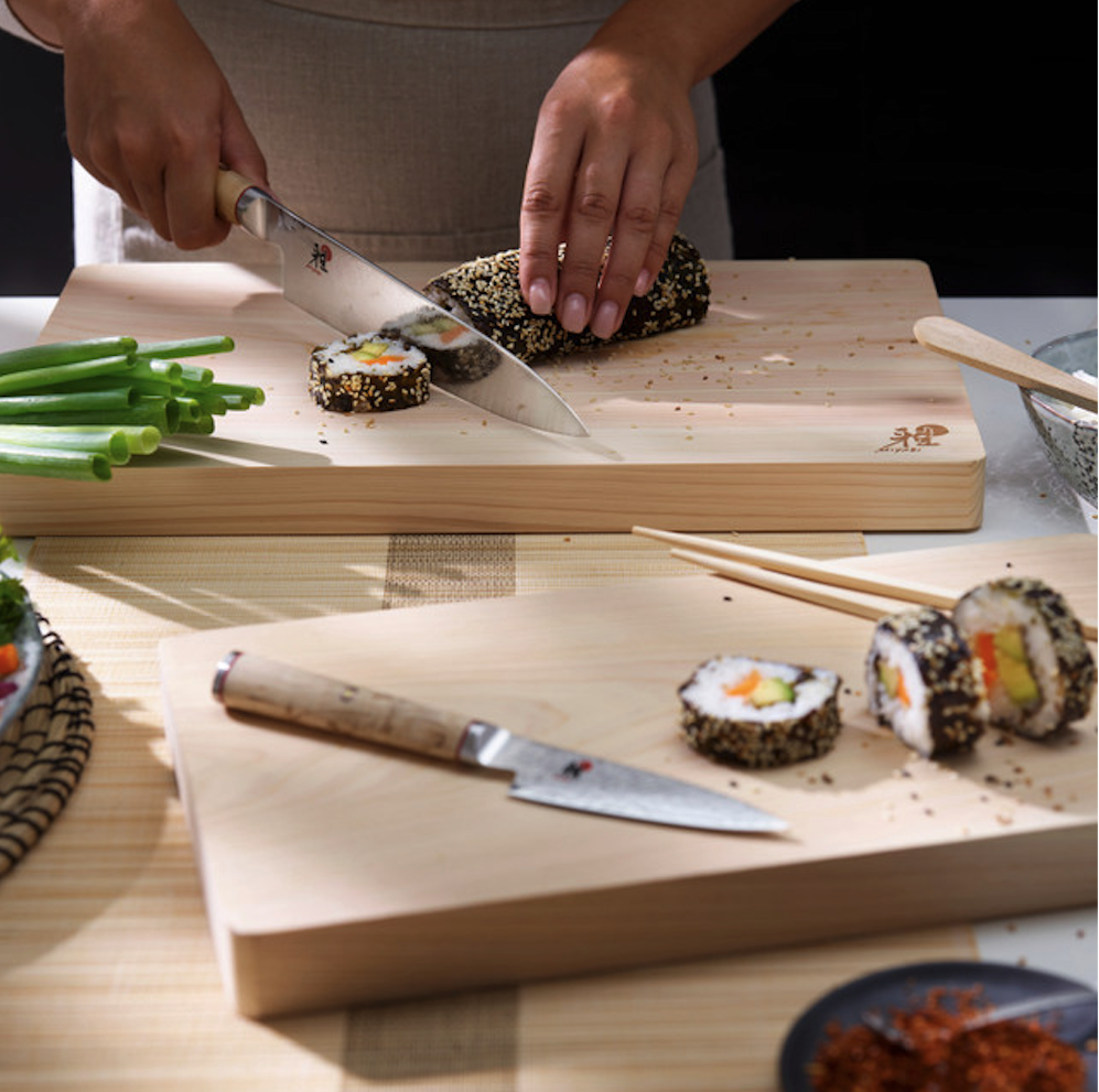 Miyabi 9cm Shotoh in foreground with slicing of sushimi in background