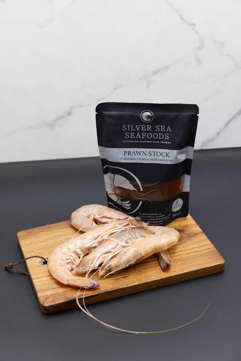 Silver Seas Seafoods Pouch on a beanch on wooden board with Mooloolaba Prawns