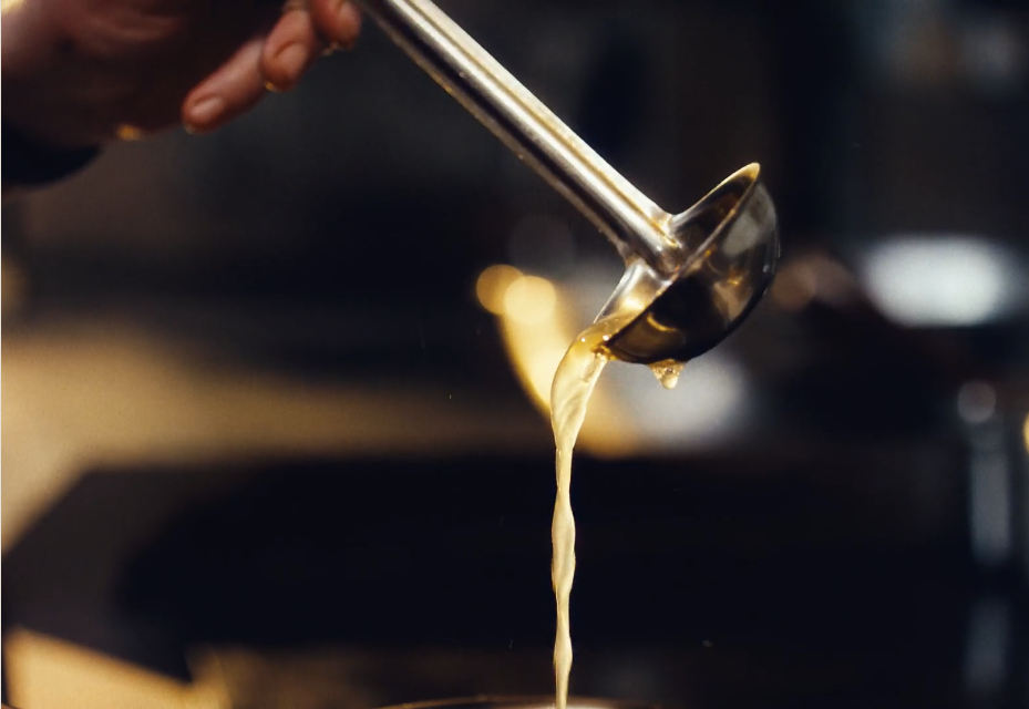 Ladle of chicken stock
