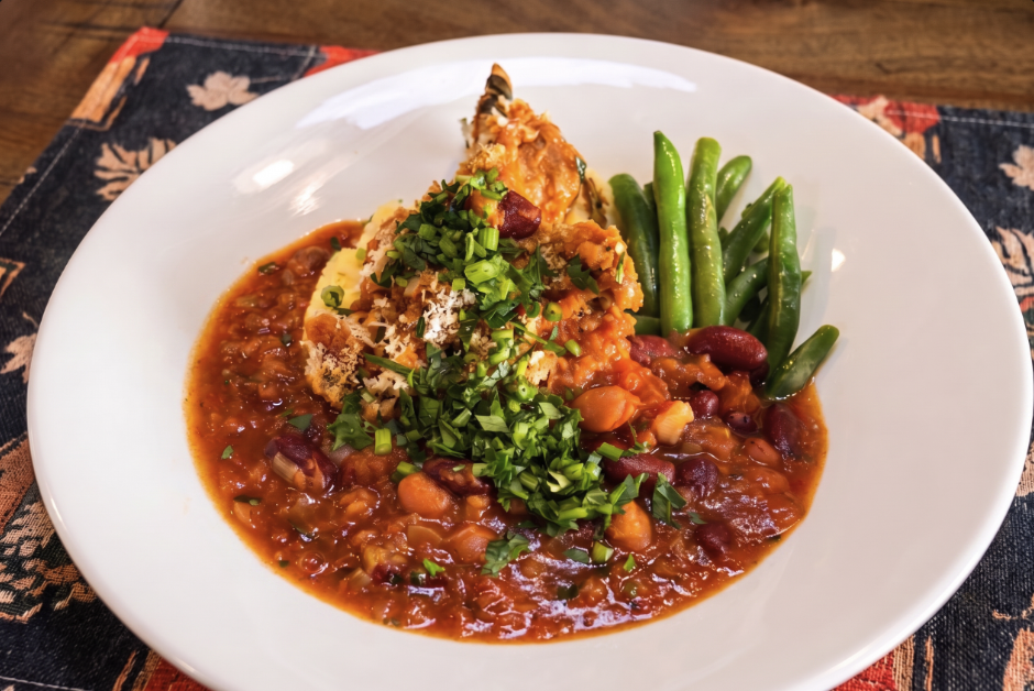 Plated Pork Loin Cassoulet with a Golden Herb Crust with mash and green beans