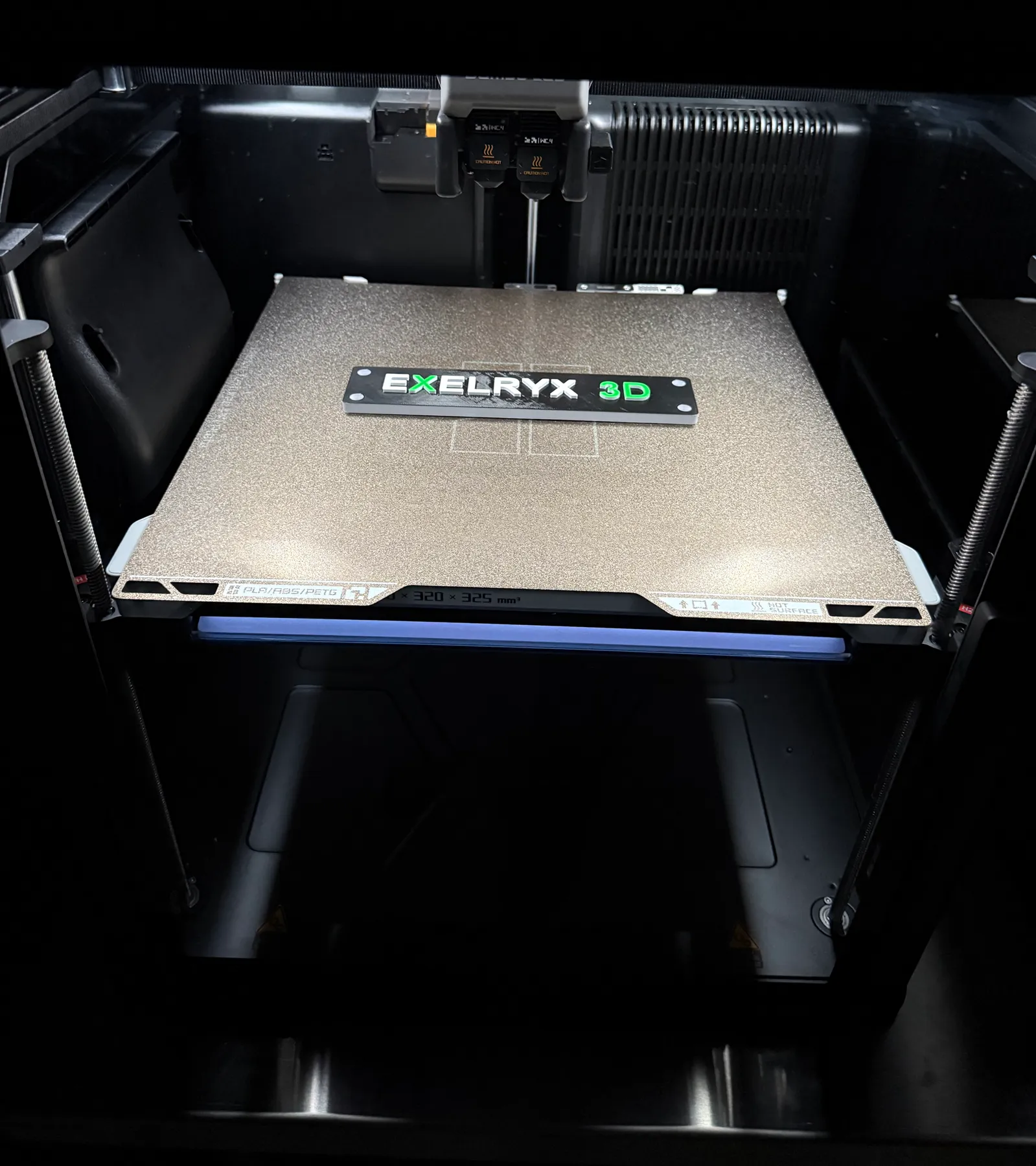 EXELRYX 3D printed placard inside an additive manufacturing machine