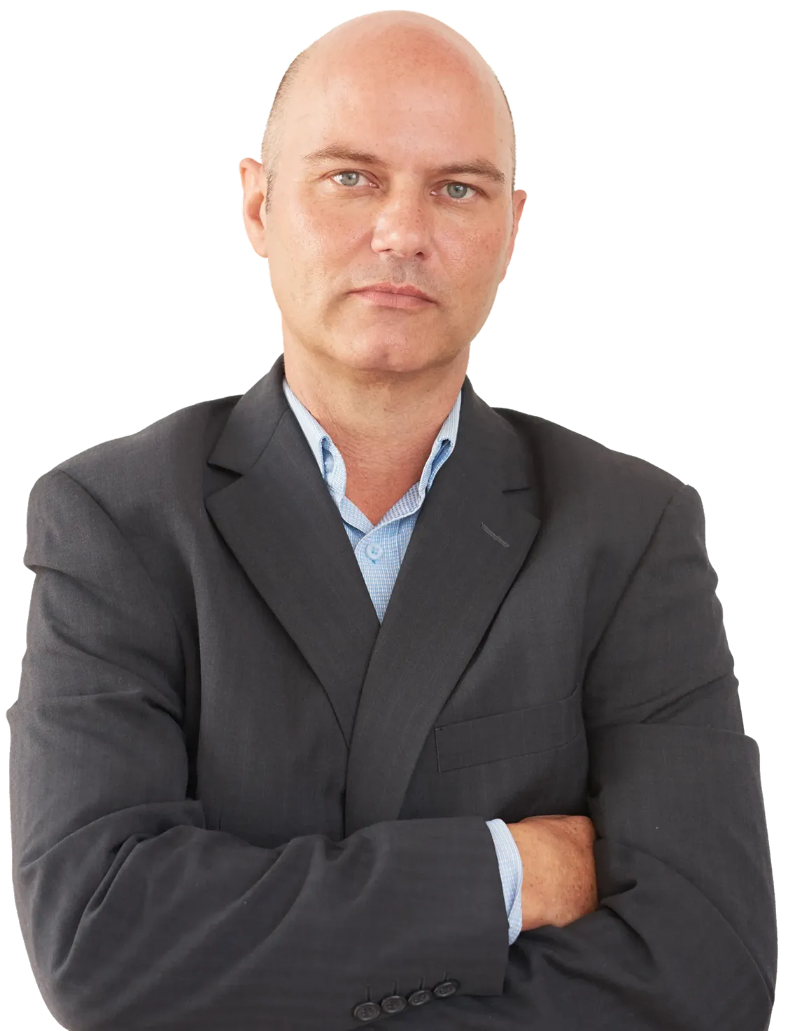 Bald man in a dark suit jacket and light blue shirt with arms crossed, looking seriously at the camera.
