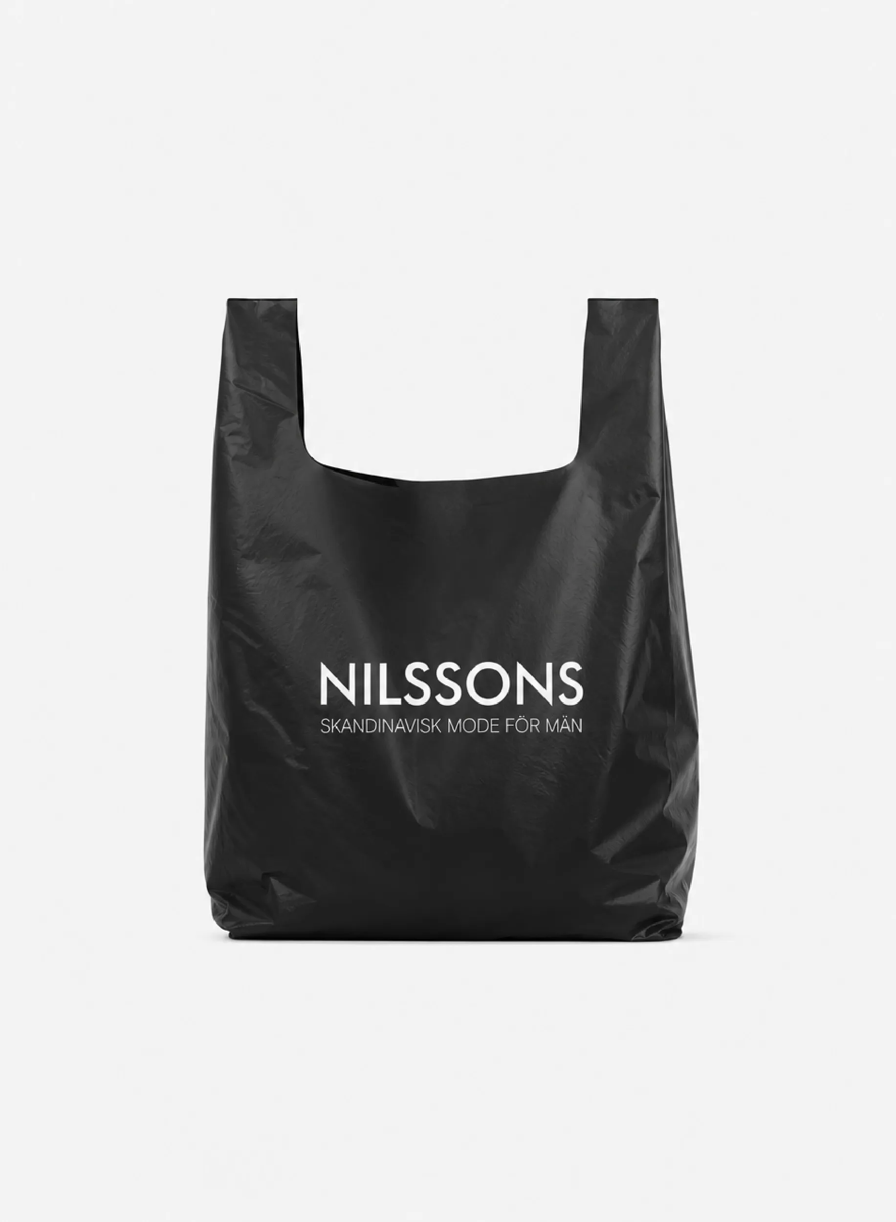 Produktbild på en plastpåse med profiltryck och utskurna handtag i t-shirtmodell.
