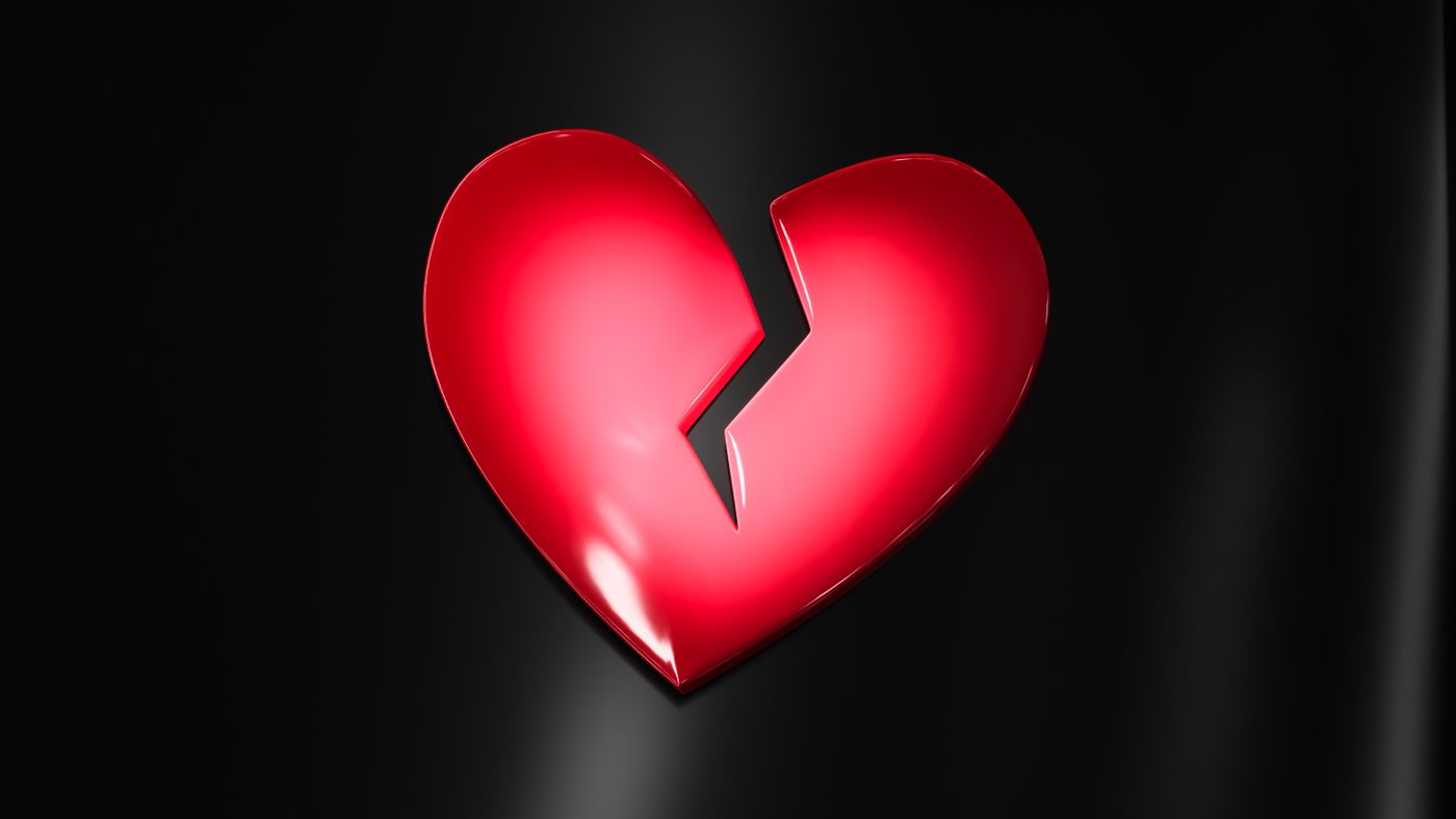 The matte red broken heart against the high-gloss black body.