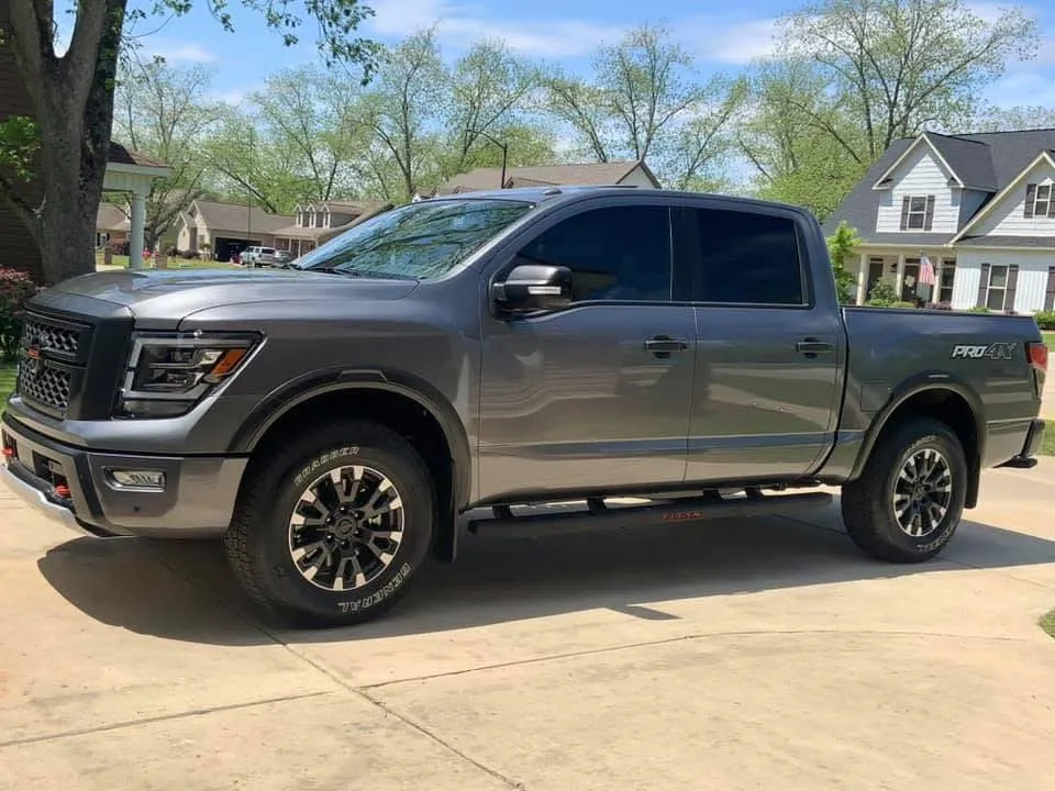 Gray Nissan Titan PRO-4X pickup truck with tinted windows.