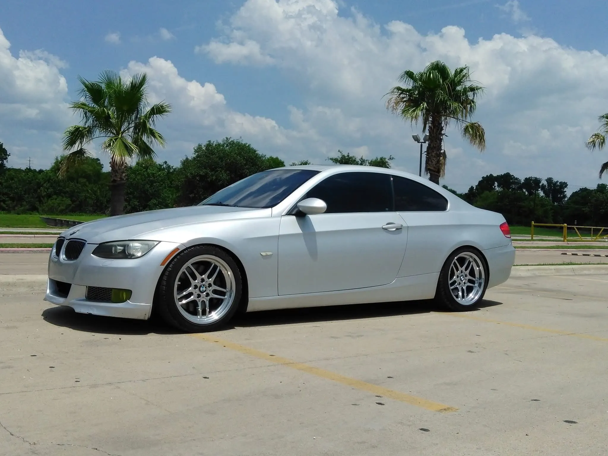 Silver BMW coupe with tinted windows.