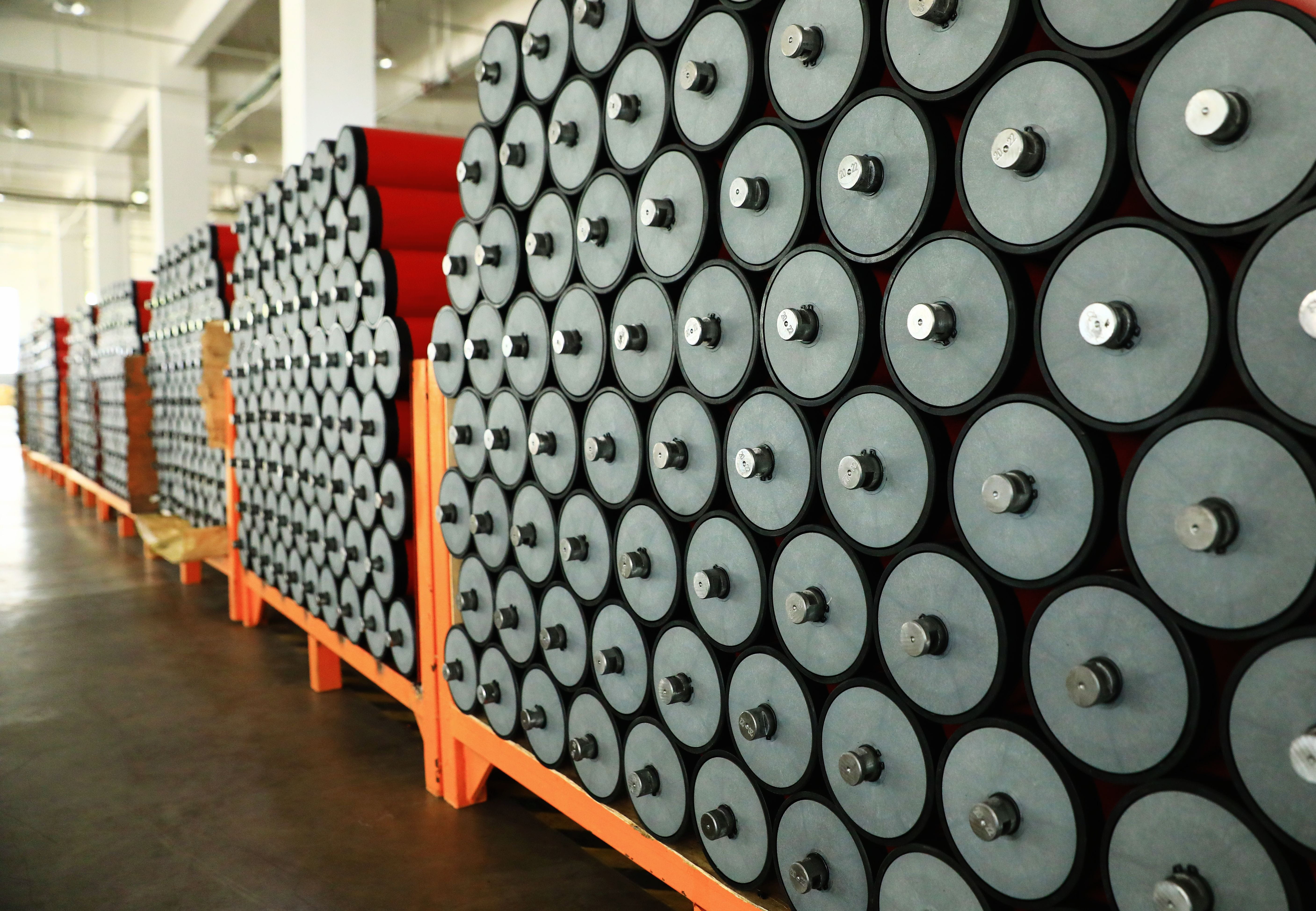 Convex red polyurethane rollers stacked