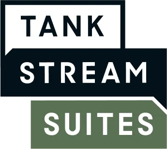 Tank Stream Suites logo with the words 'TANK', 'STREAM', and 'SUITES' stacked vertically in separate colored speech bubbles.