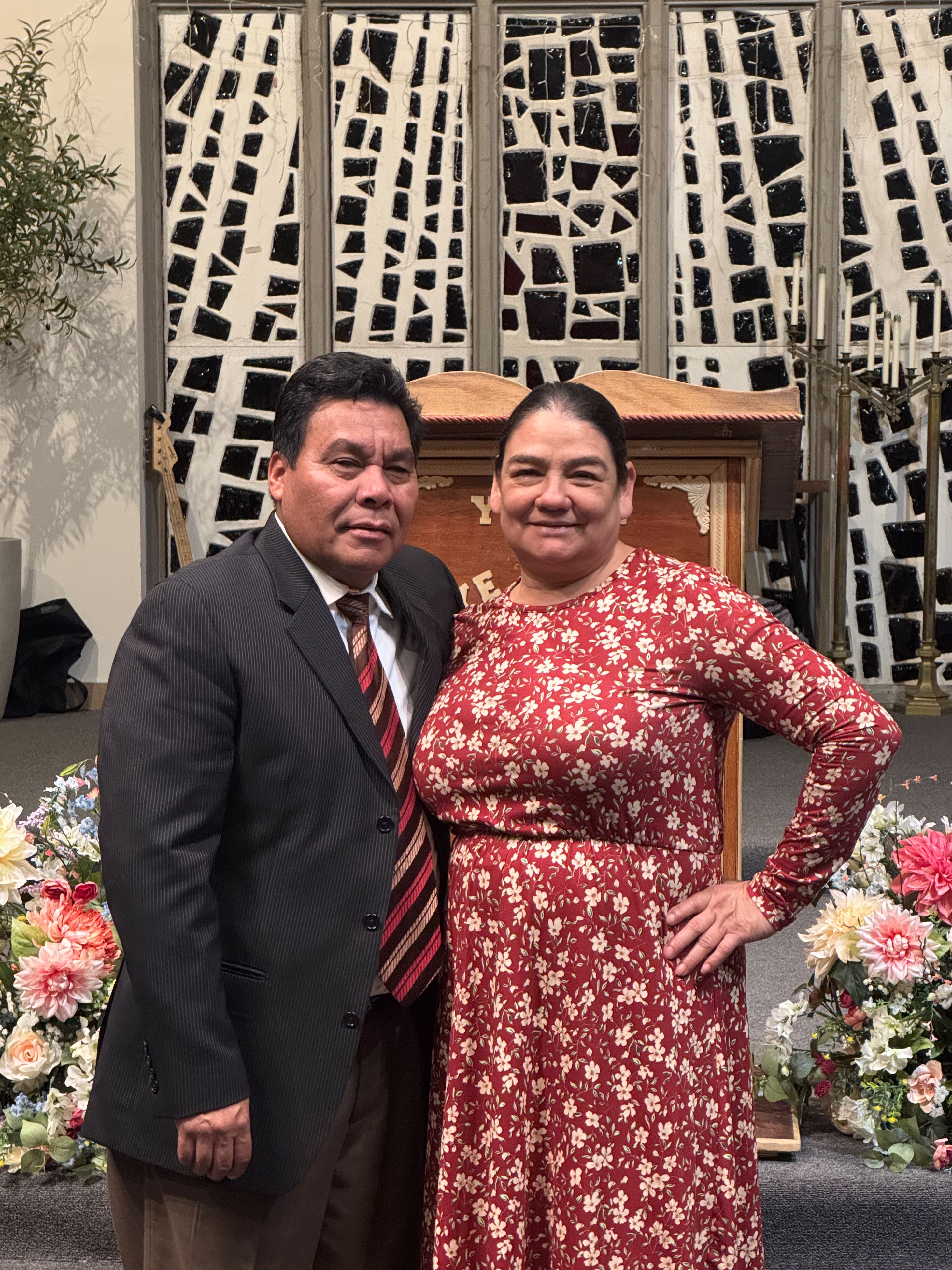 image of team in front of company building (for a roofing contractor)