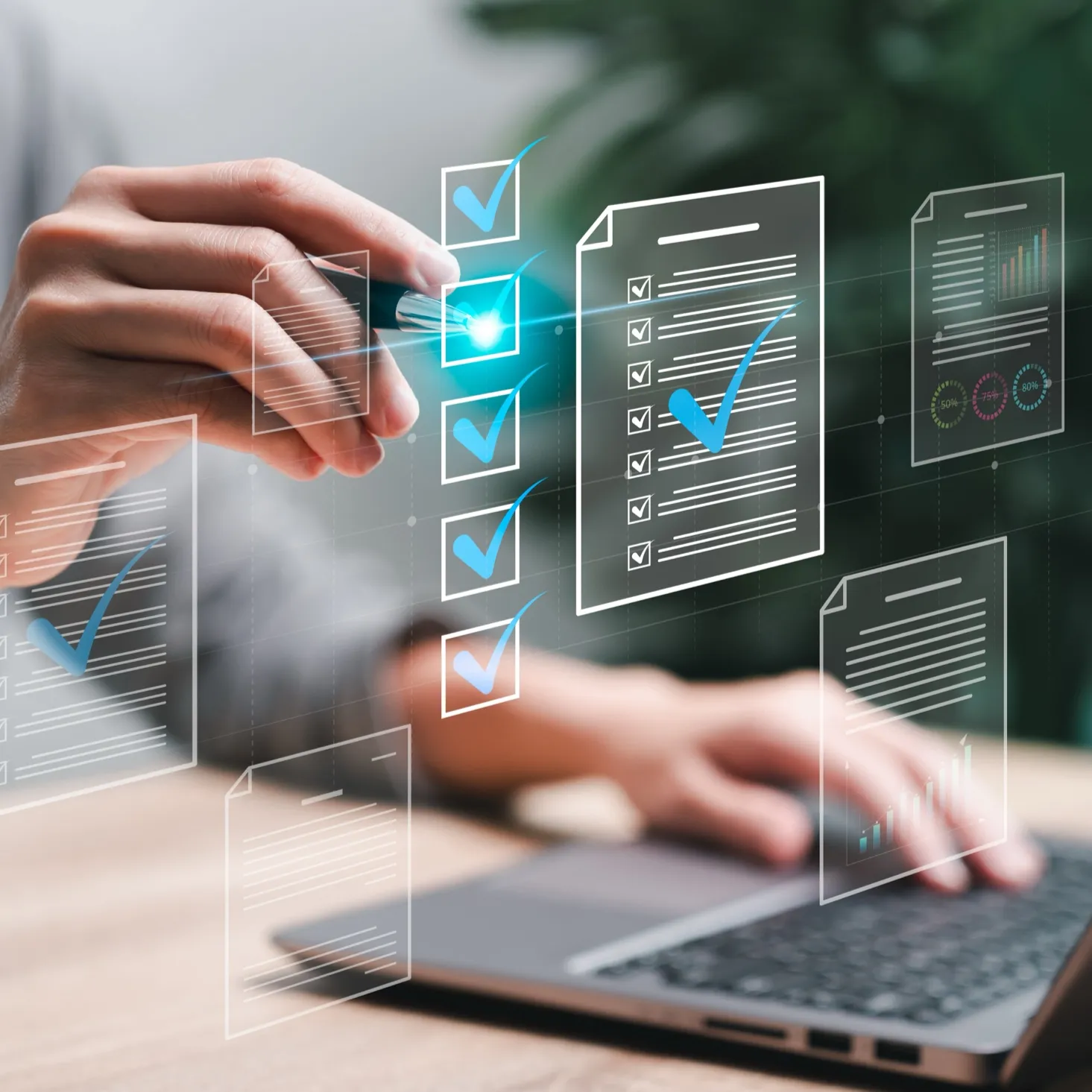 Hand with pen checking off digital checklist icons floating over a laptop keyboard.