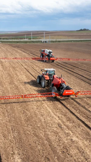 Two tractors on a field.