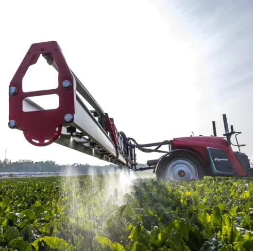 A big tractor machine watering the field.