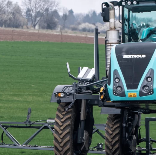 A close image of a tractor machine on a field.