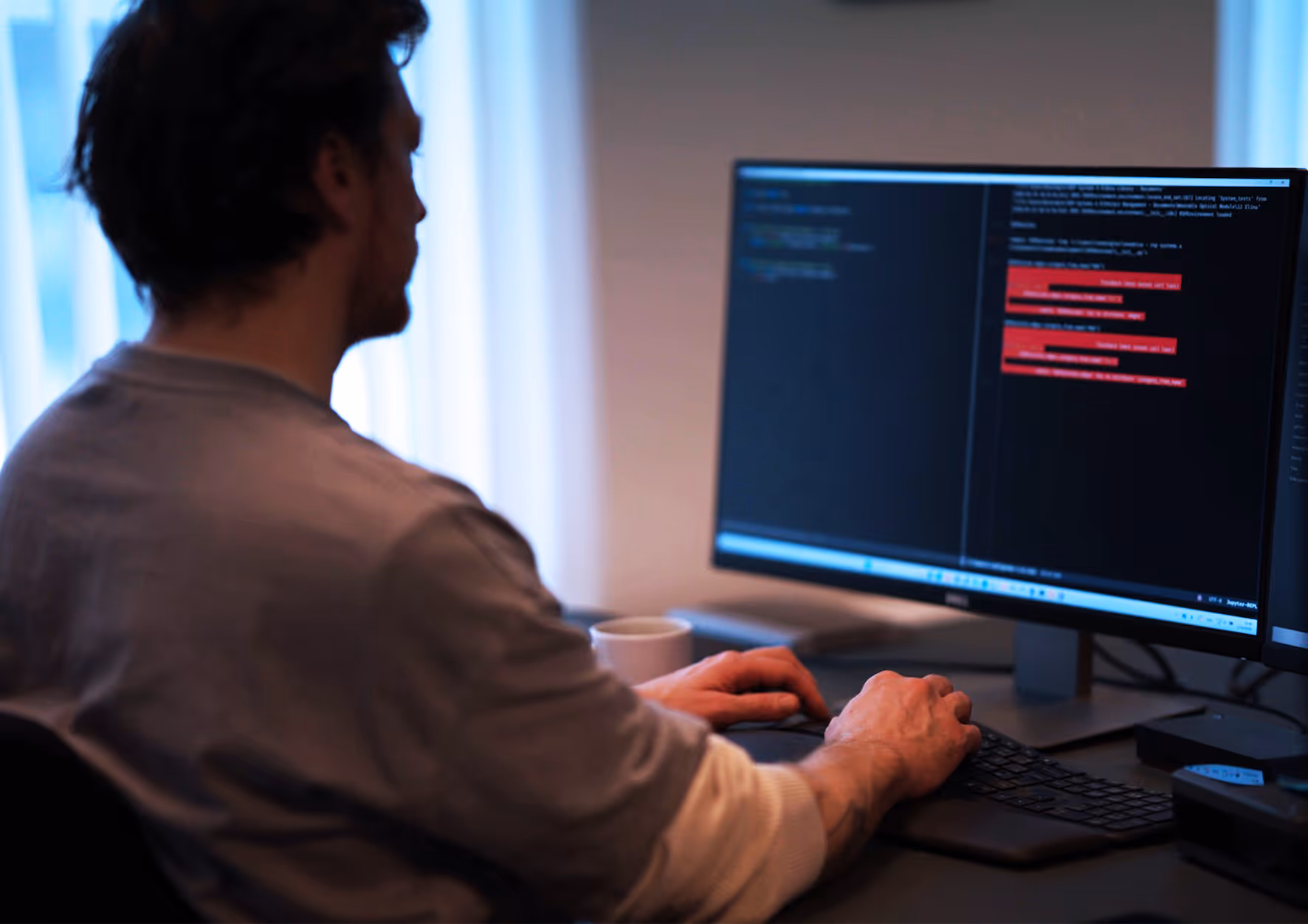 A person working with updates and data at their desk