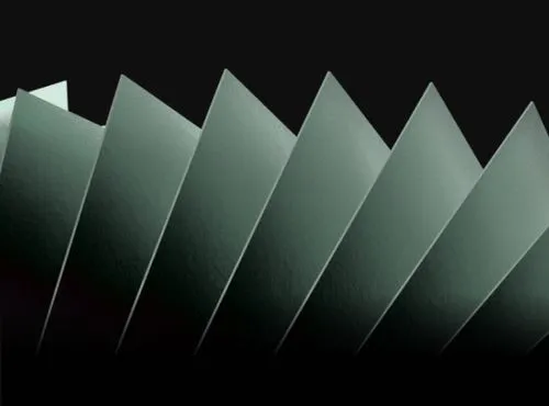 Close-up of a spiral staircase with white lines on black steps creating a geometric pattern.