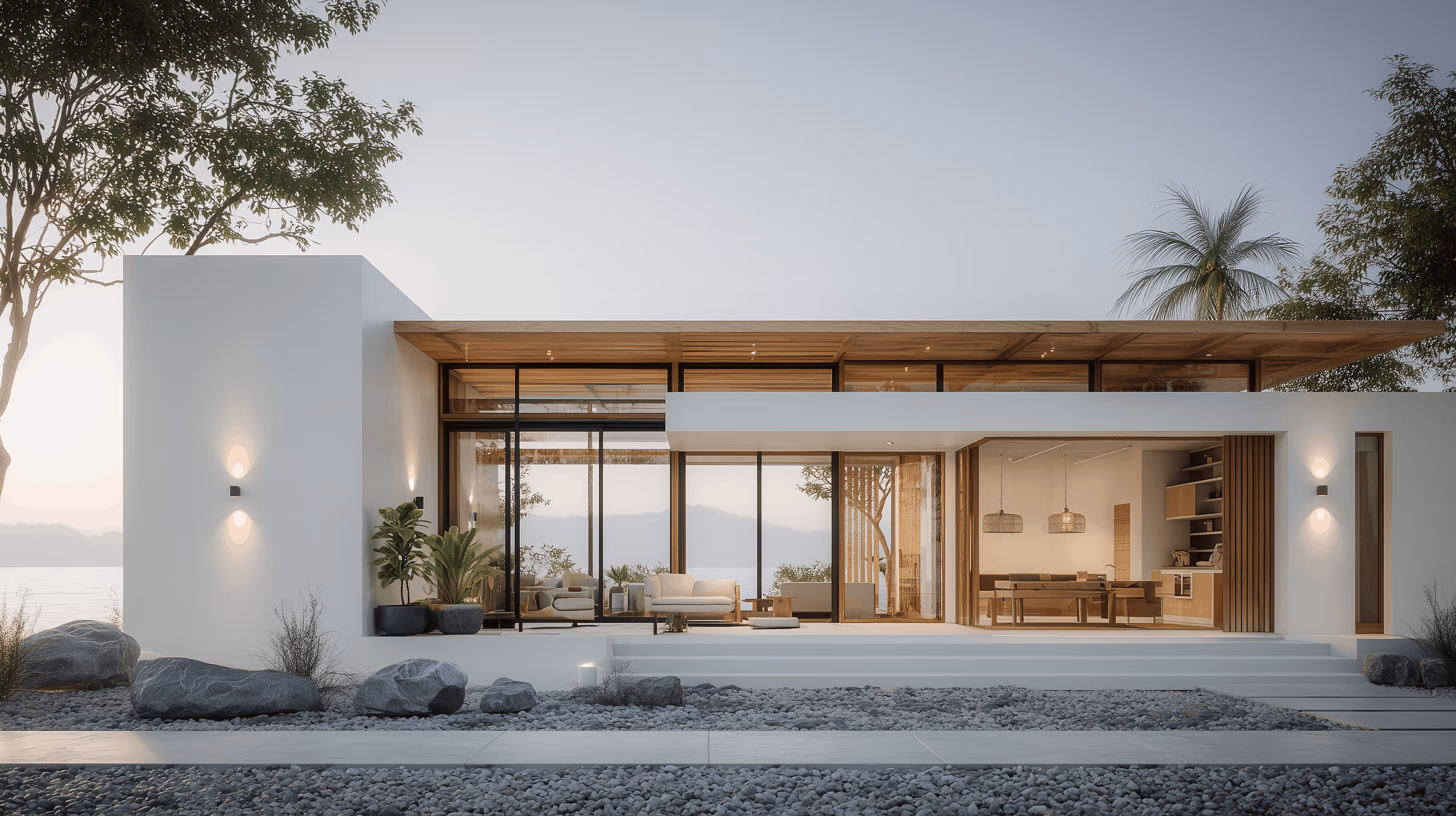 Bacchus & Partners - Modern white house with large glass windows, wooden ceiling, outdoor seating, and rock landscaping.