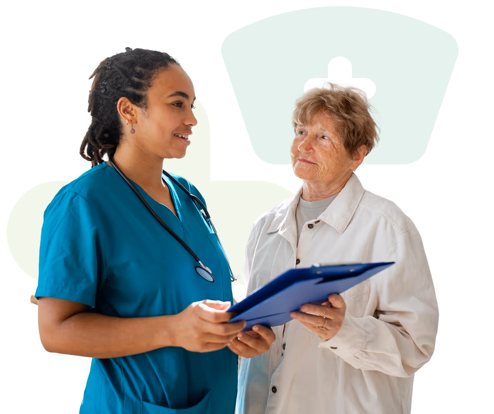 Nurse in teal scrubs holding a clipboard and talking with an elderly woman in a white jacket.