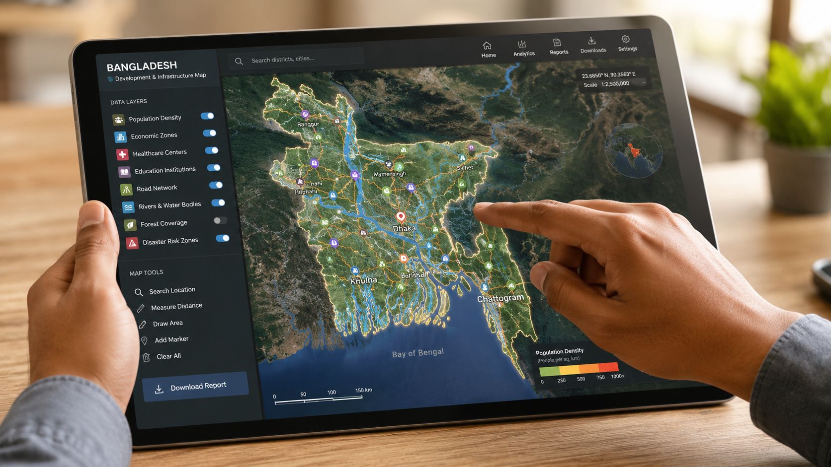 A person using a digital tablet to view an interactive development and infrastructure map of Bangladesh.