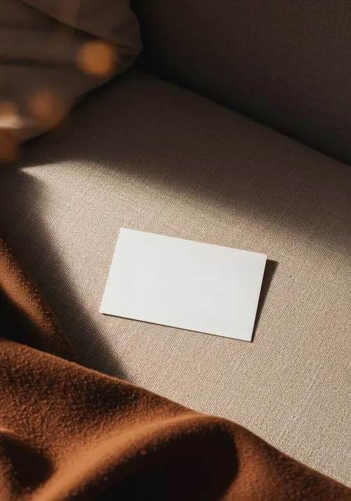 A piece of paper sitting on top of a couch.