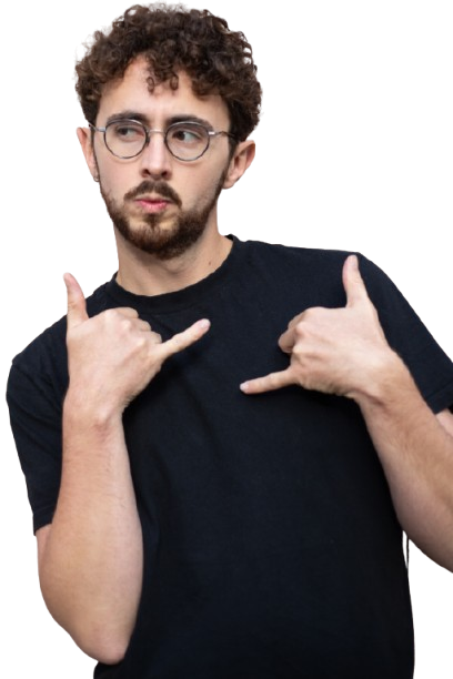 Young man with curly hair and beard wearing glasses and a black t-shirt making a shaka hand gesture with both hands.