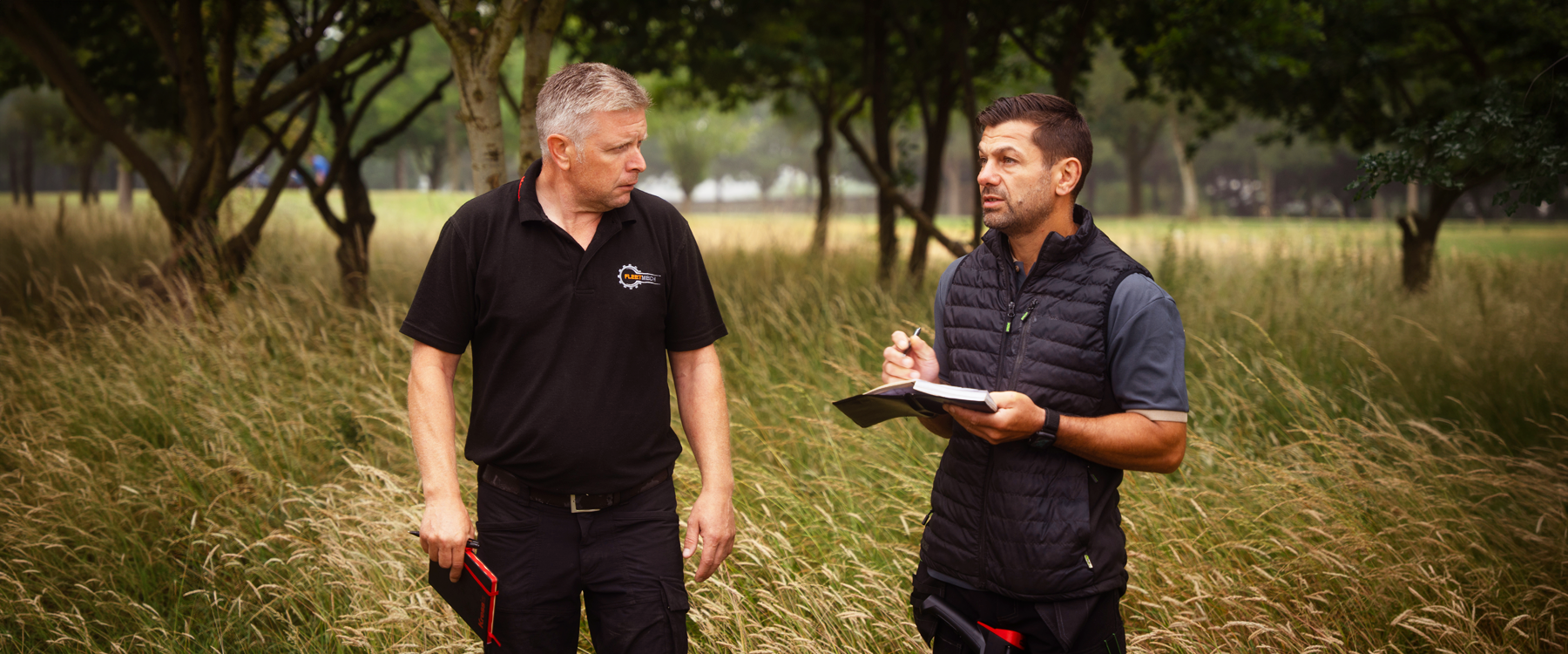 Kress-shop.co.uk staff surveying a professional golf course and offering guidance for the ideal robotic mower configuration