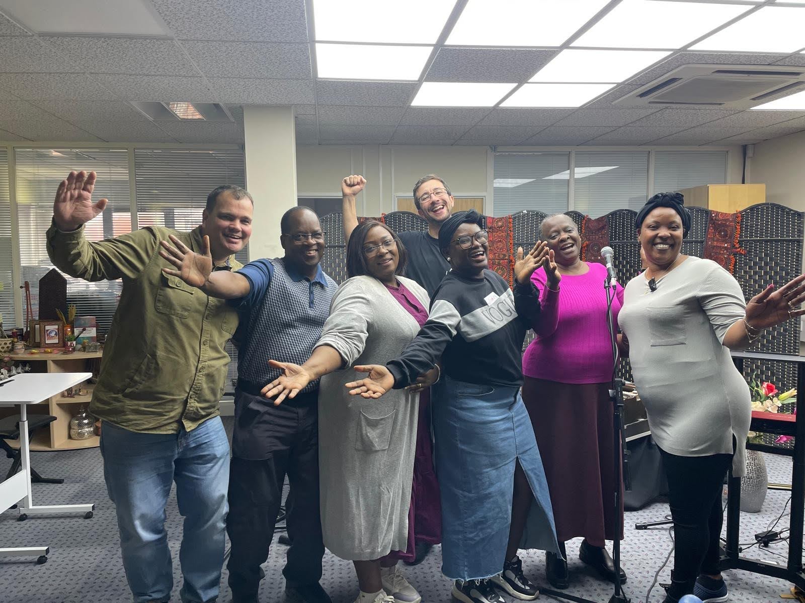 Community leaders smiling at a workshop
