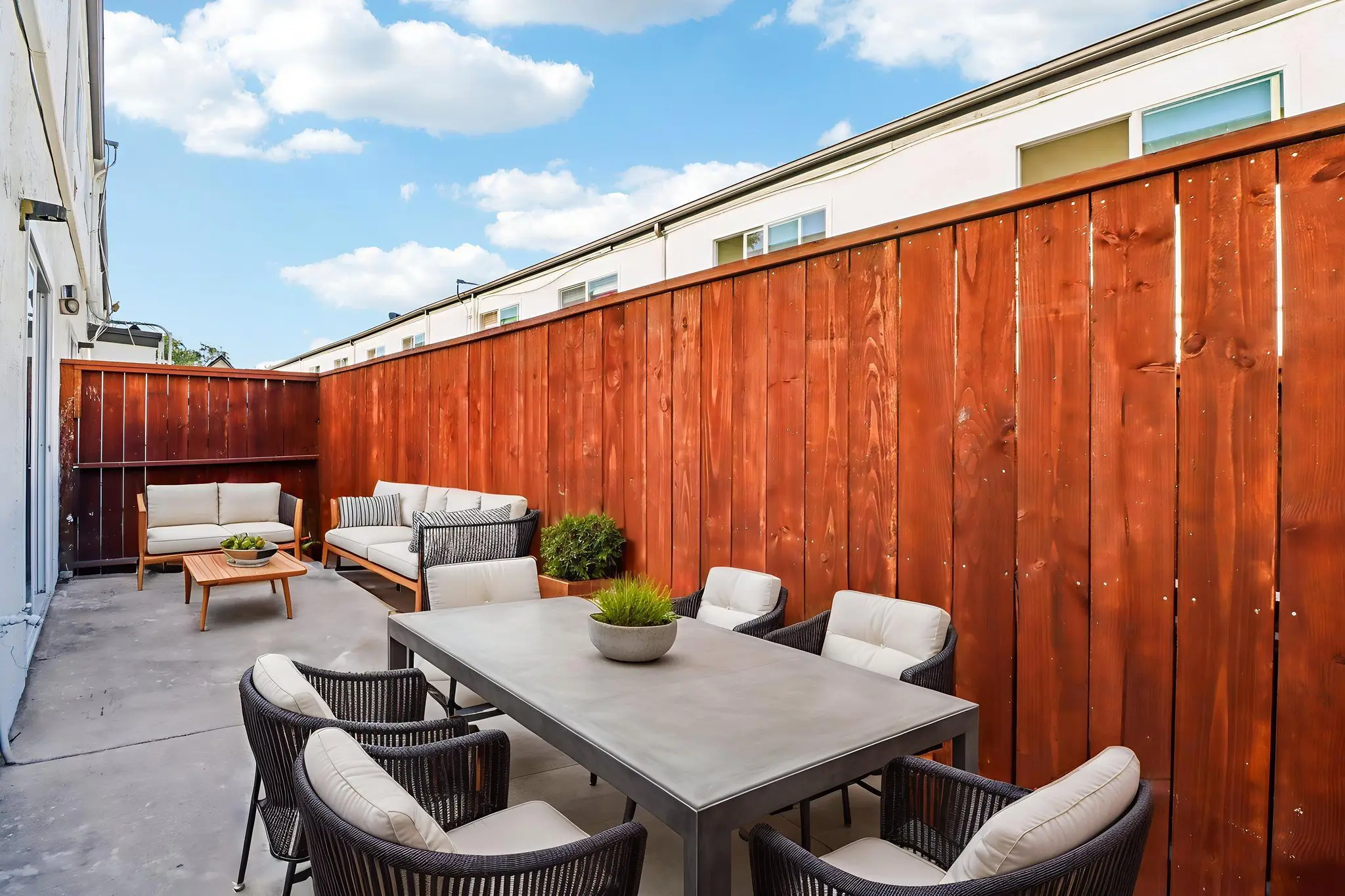 Private Patio fenced in with table and chairs 